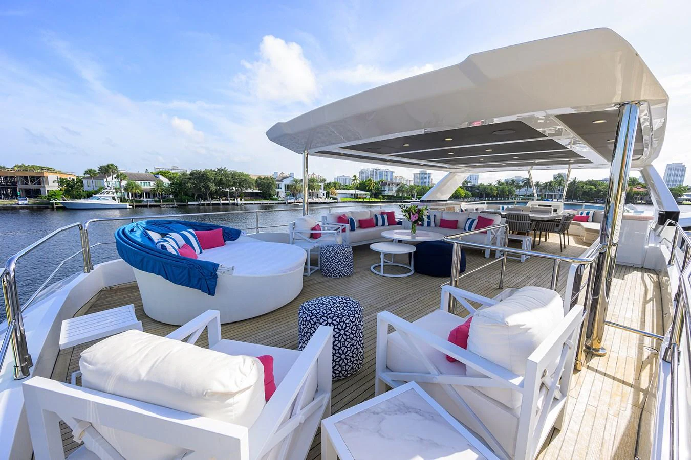 a deck with lounge chairs and a pool with a view of the water aboard C3 Yacht for Sale
