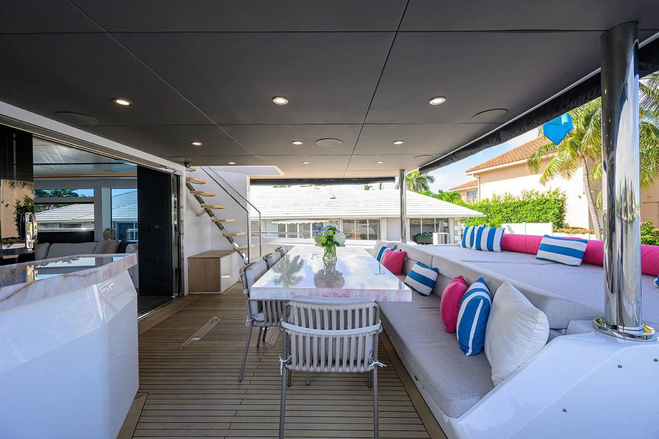 a room with a table chairs and a couch aboard C3 Yacht for Sale