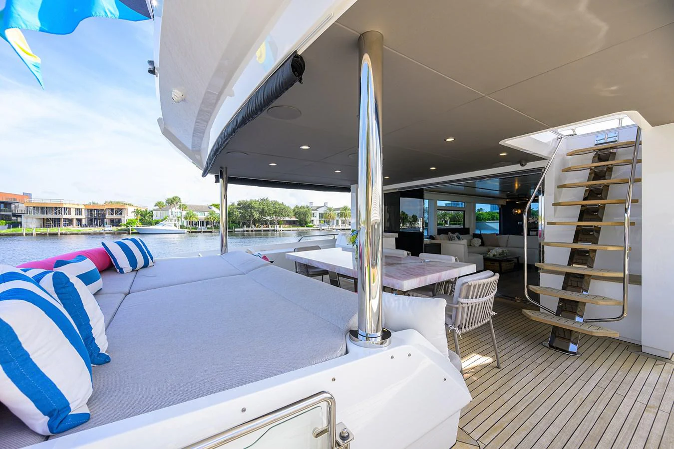 a large white tent with a table and chairs aboard C3 Yacht for Sale