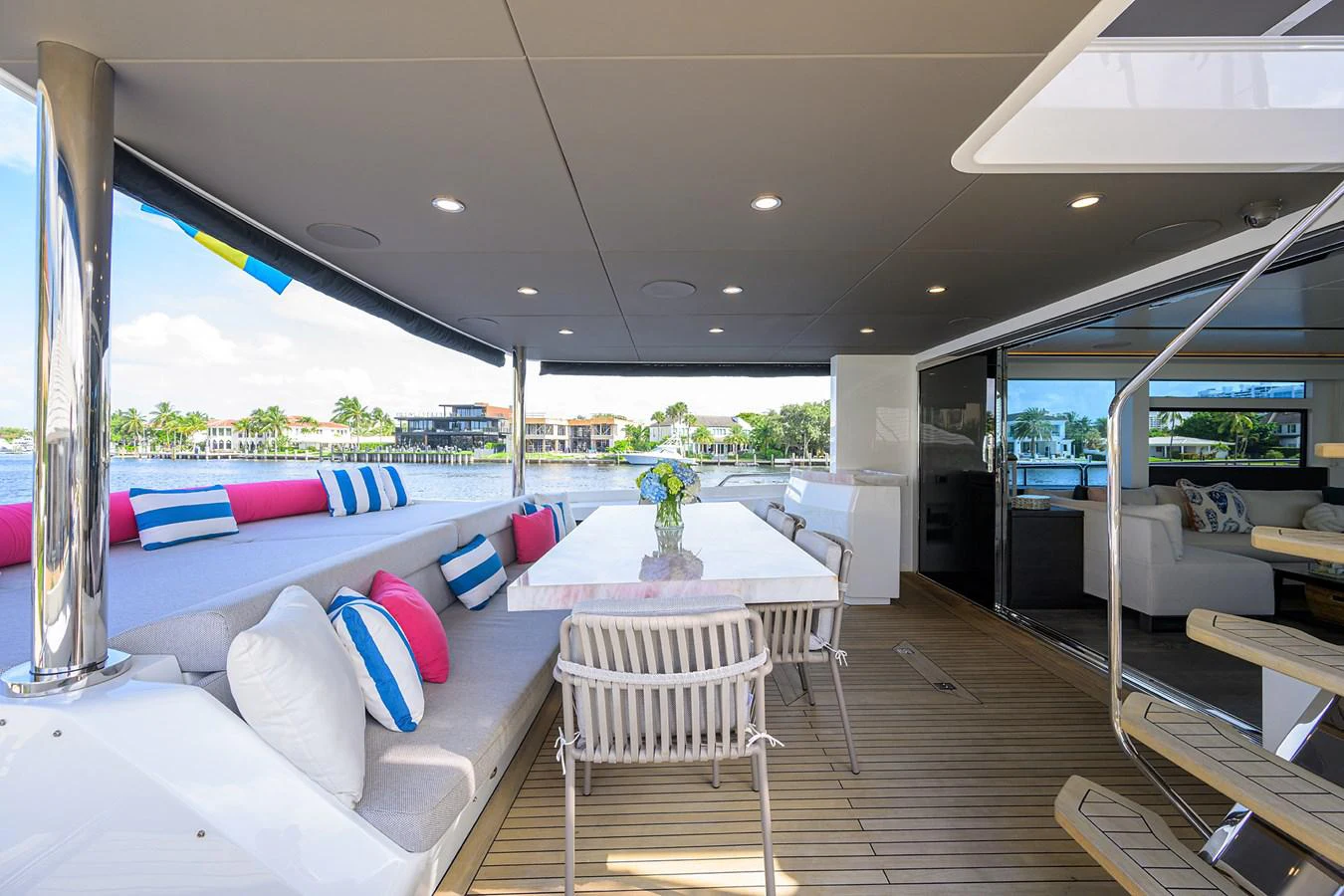 a room with a table and chairs aboard C3 Yacht for Sale