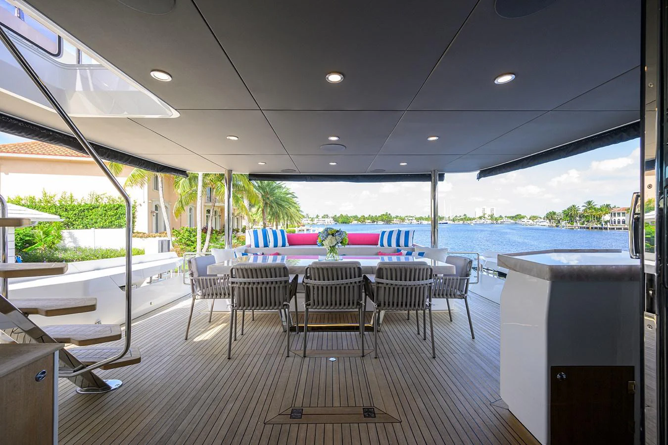 a room with a table and chairs aboard C3 Yacht for Sale
