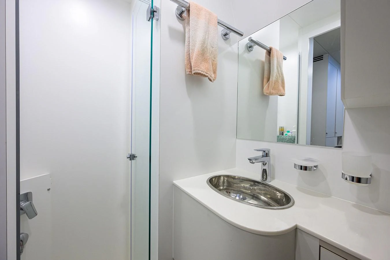 a bathroom with a sink and a mirror aboard C3 Yacht for Sale