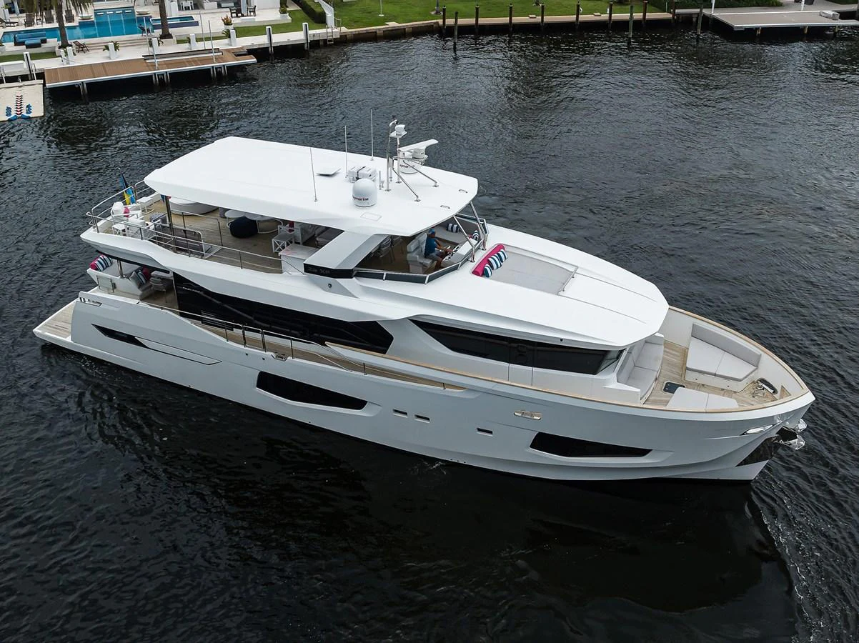 a white boat on the water aboard C3 Yacht for Sale
