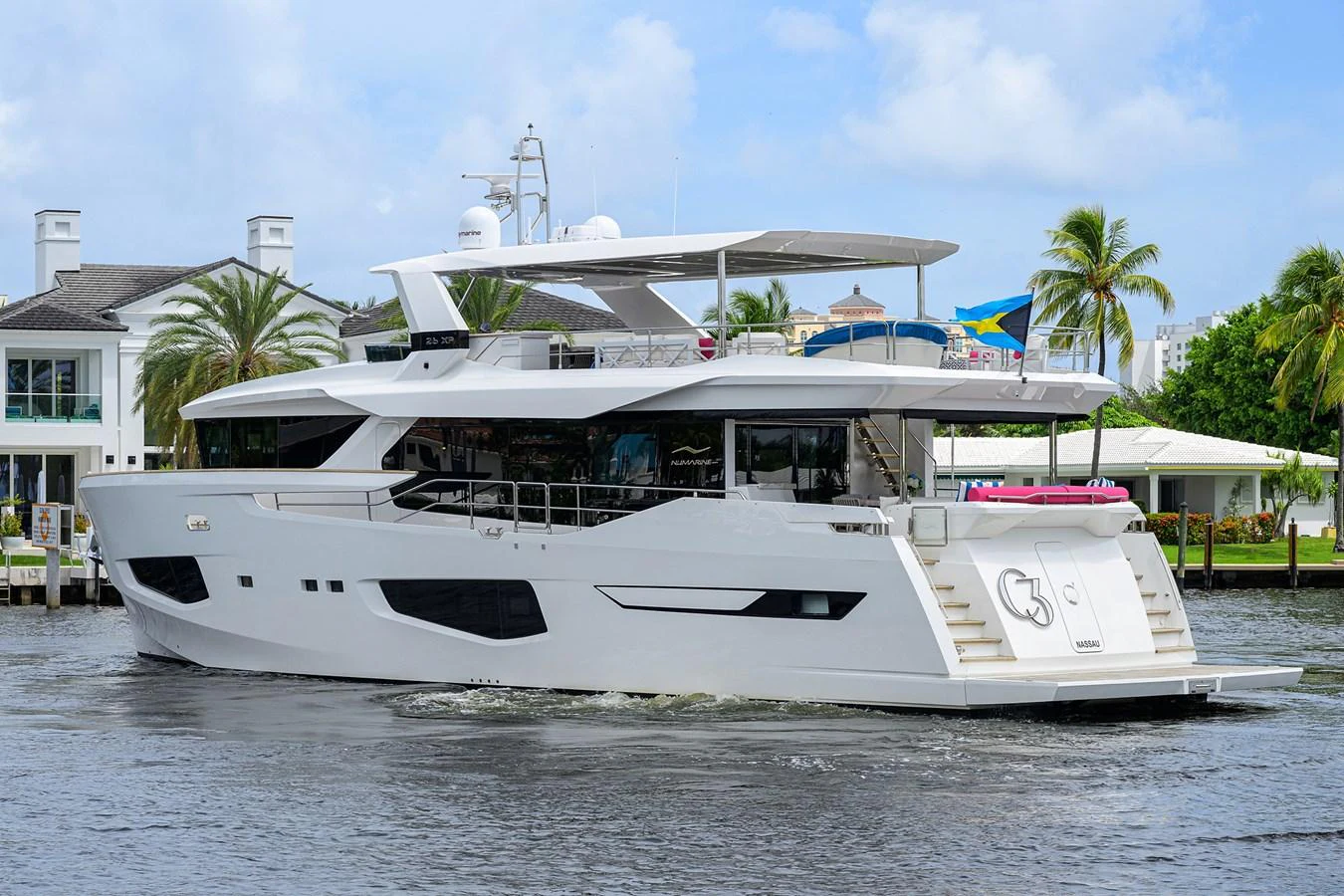 a white boat on the water aboard C3 Yacht for Sale