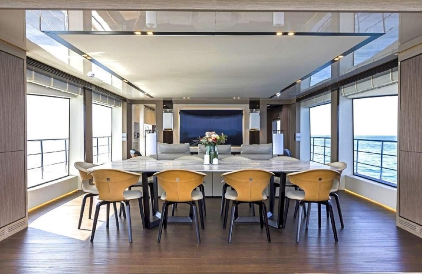 a large conference room with tables and chairs aboard EDEN Yacht for Sale