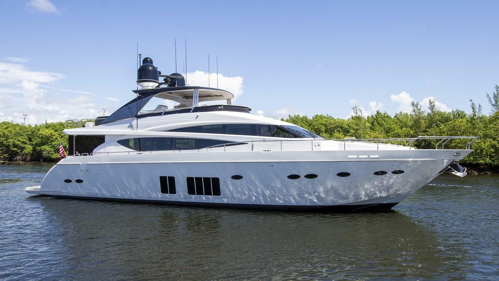 a white yacht on the water aboard ENTOURAGE Yacht for Sale