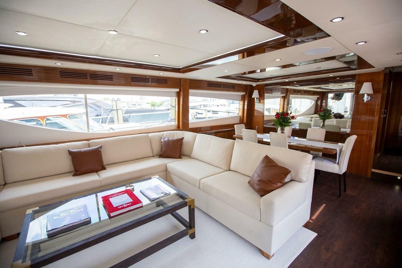 a living room with a large window aboard ENTOURAGE Yacht for Sale