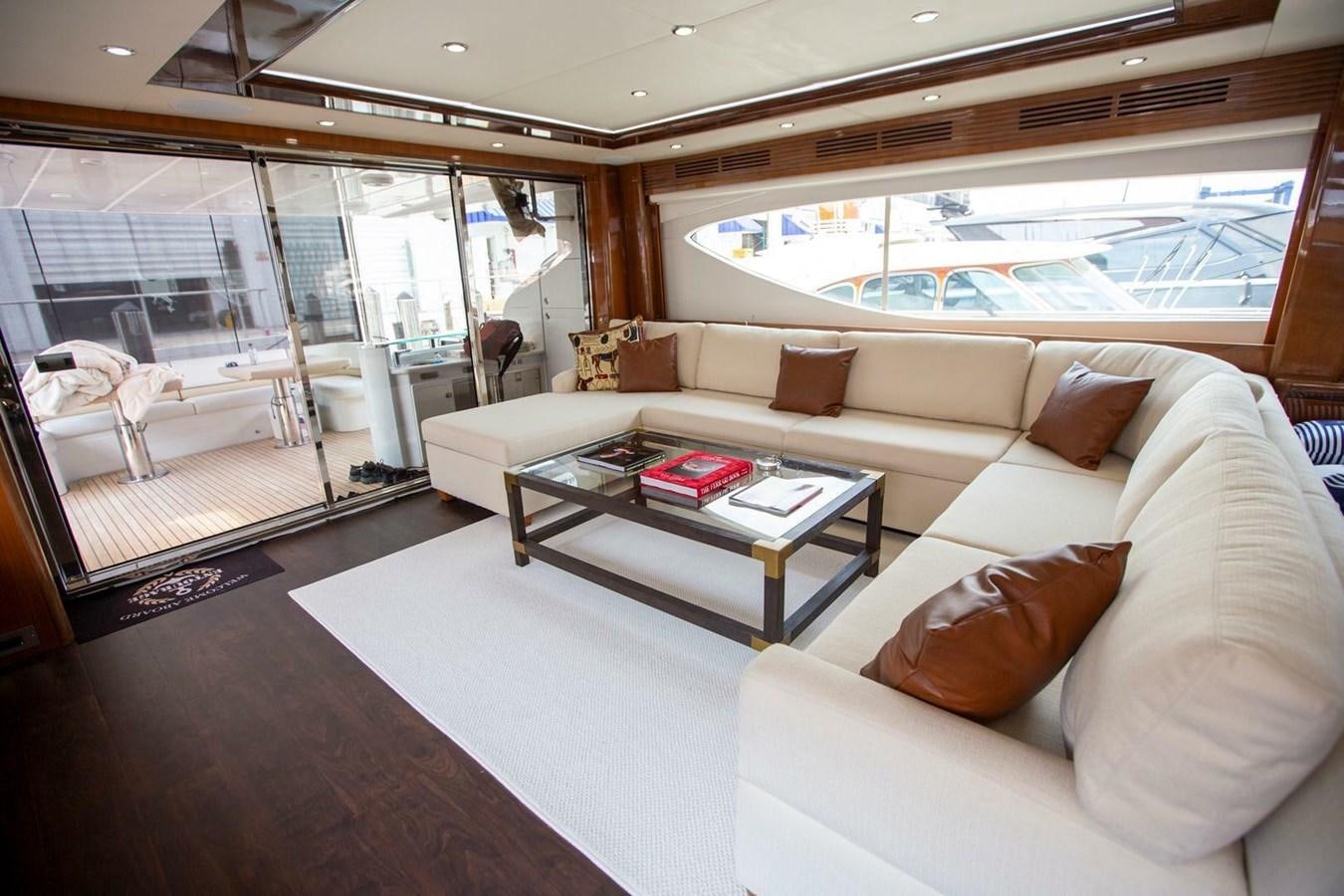 a living room with a large window aboard ENTOURAGE Yacht for Sale