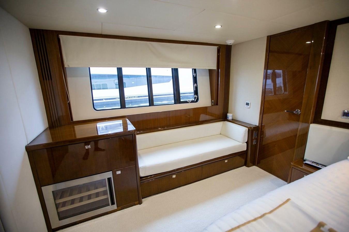 a room with a bed and a window aboard ENTOURAGE Yacht for Sale