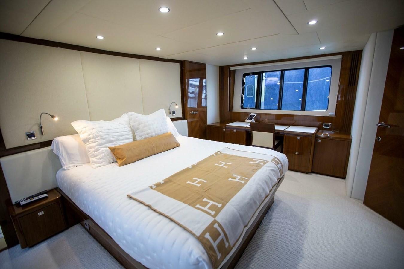 a hotel room with a bed aboard ENTOURAGE Yacht for Sale