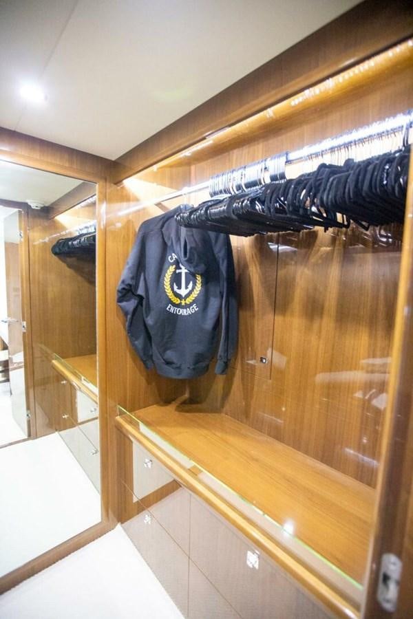 a blue jacket on a wooden wall aboard ENTOURAGE Yacht for Sale
