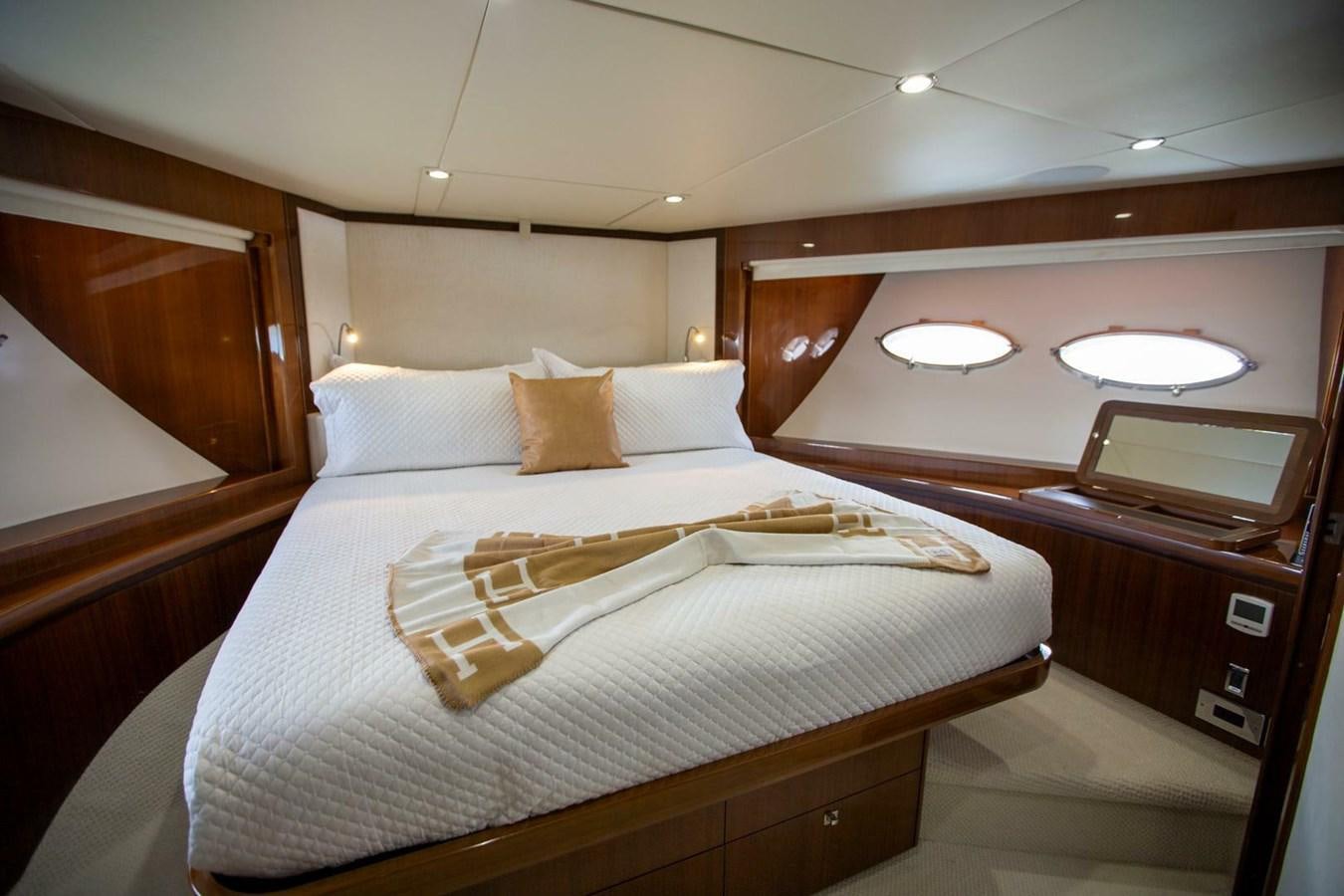 a bed with white sheets aboard ENTOURAGE Yacht for Sale