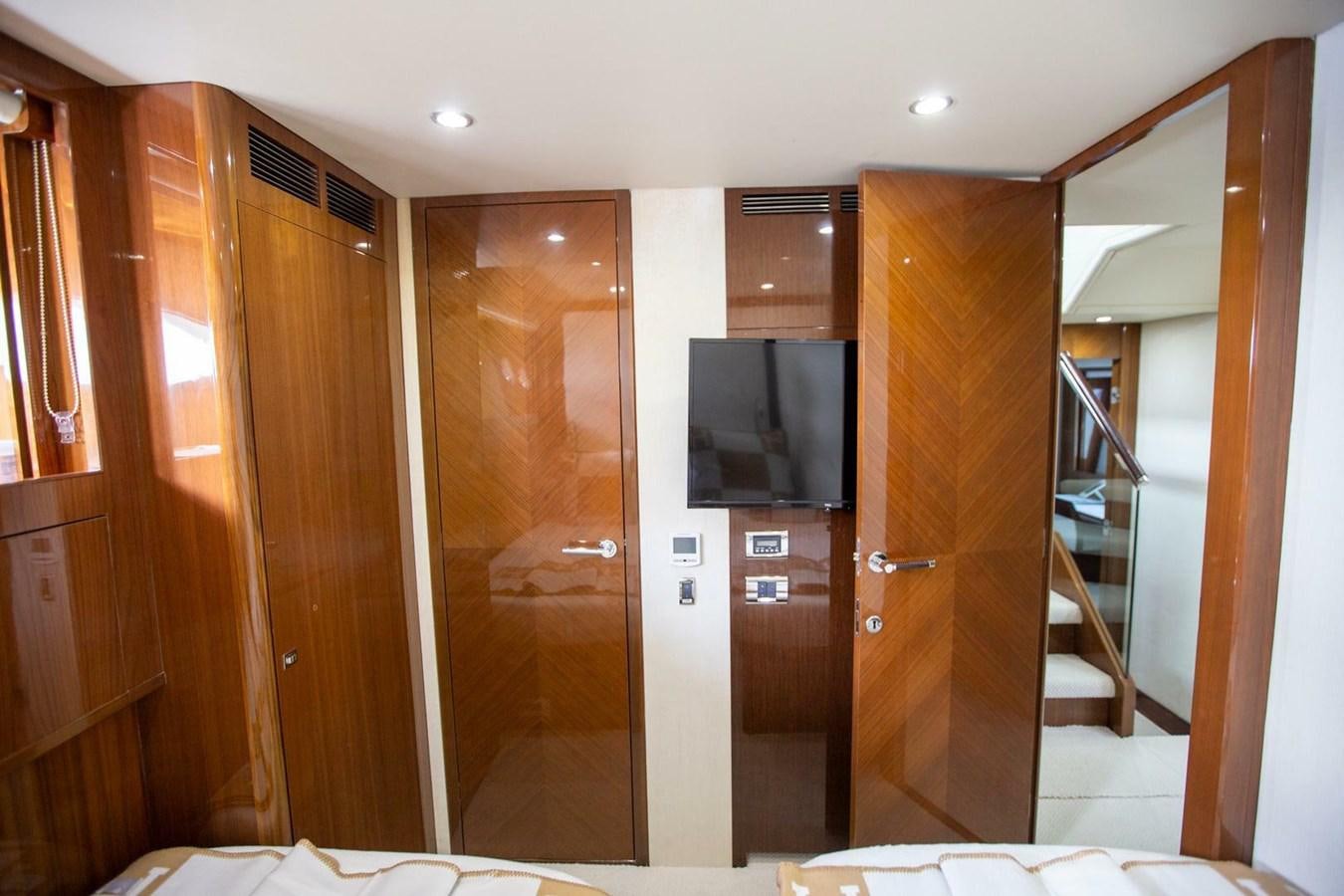 a room with wooden cabinets aboard ENTOURAGE Yacht for Sale