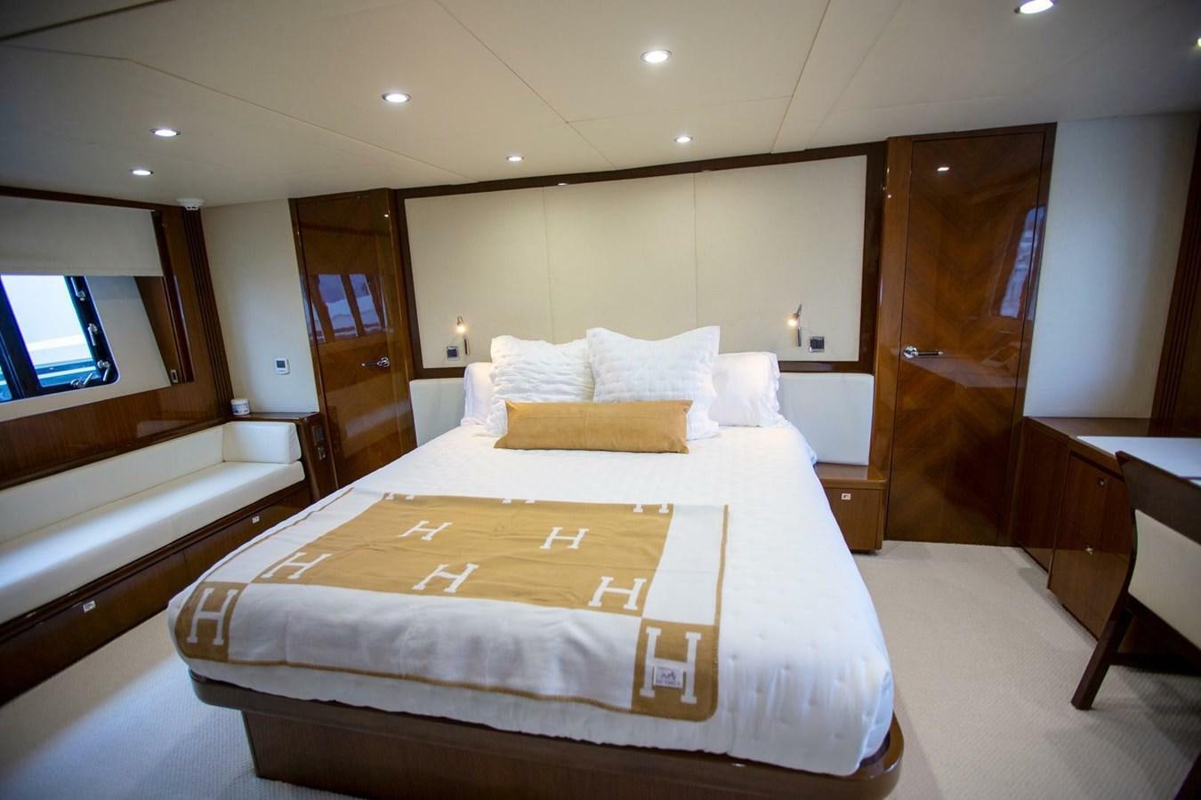a room with a bed and a door aboard ENTOURAGE Yacht for Sale