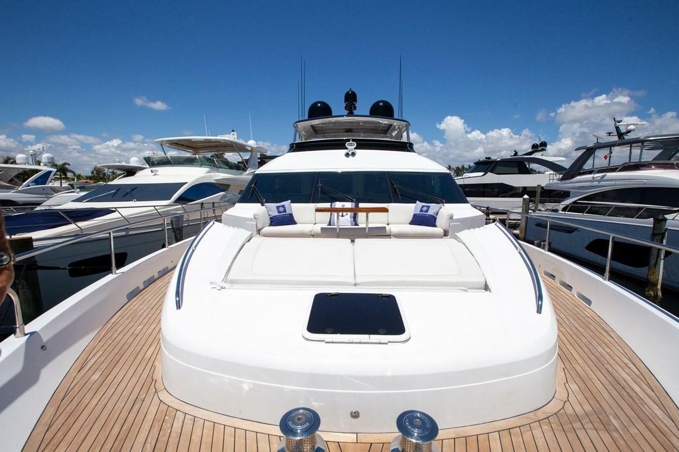 a white yacht on a deck aboard ENTOURAGE Yacht for Sale