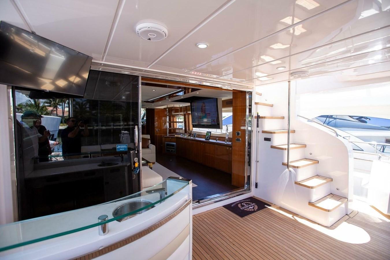 a room with a glass door and a staircase aboard ENTOURAGE Yacht for Sale