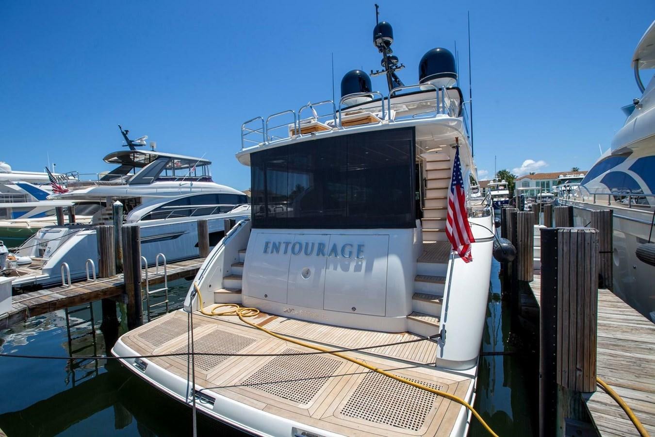 a boat docked at a pier aboard ENTOURAGE Yacht for Sale