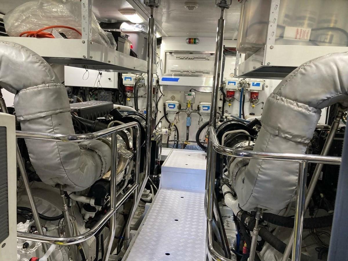 a room with a few chairs and a table aboard ENTOURAGE Yacht for Sale