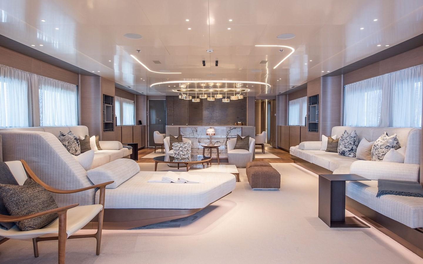 a living room with white furniture aboard FLORENTIA Yacht for Sale