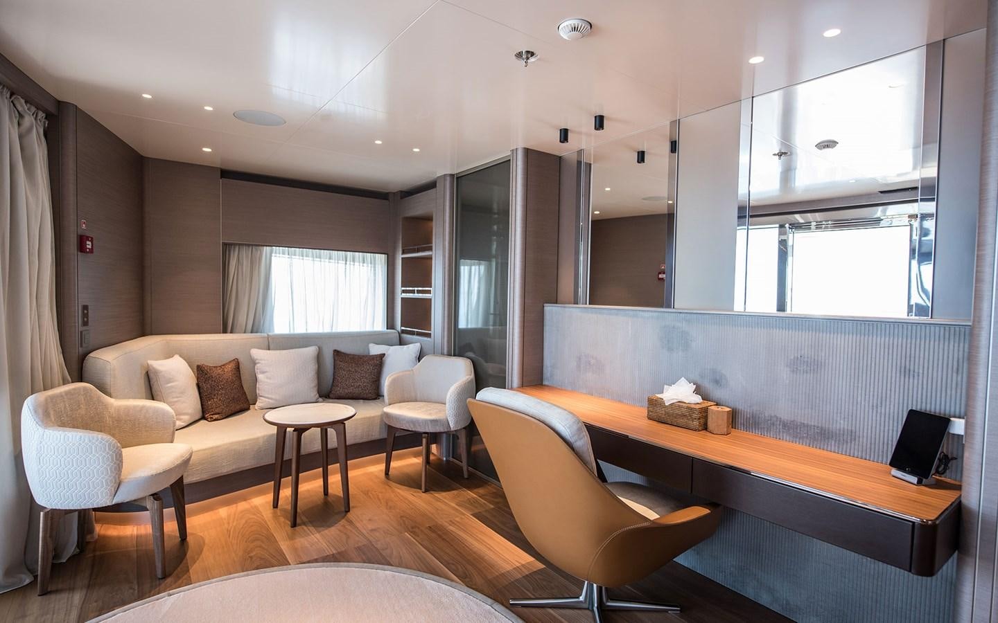 a room with a couch and a table and chairs aboard FLORENTIA Yacht for Sale