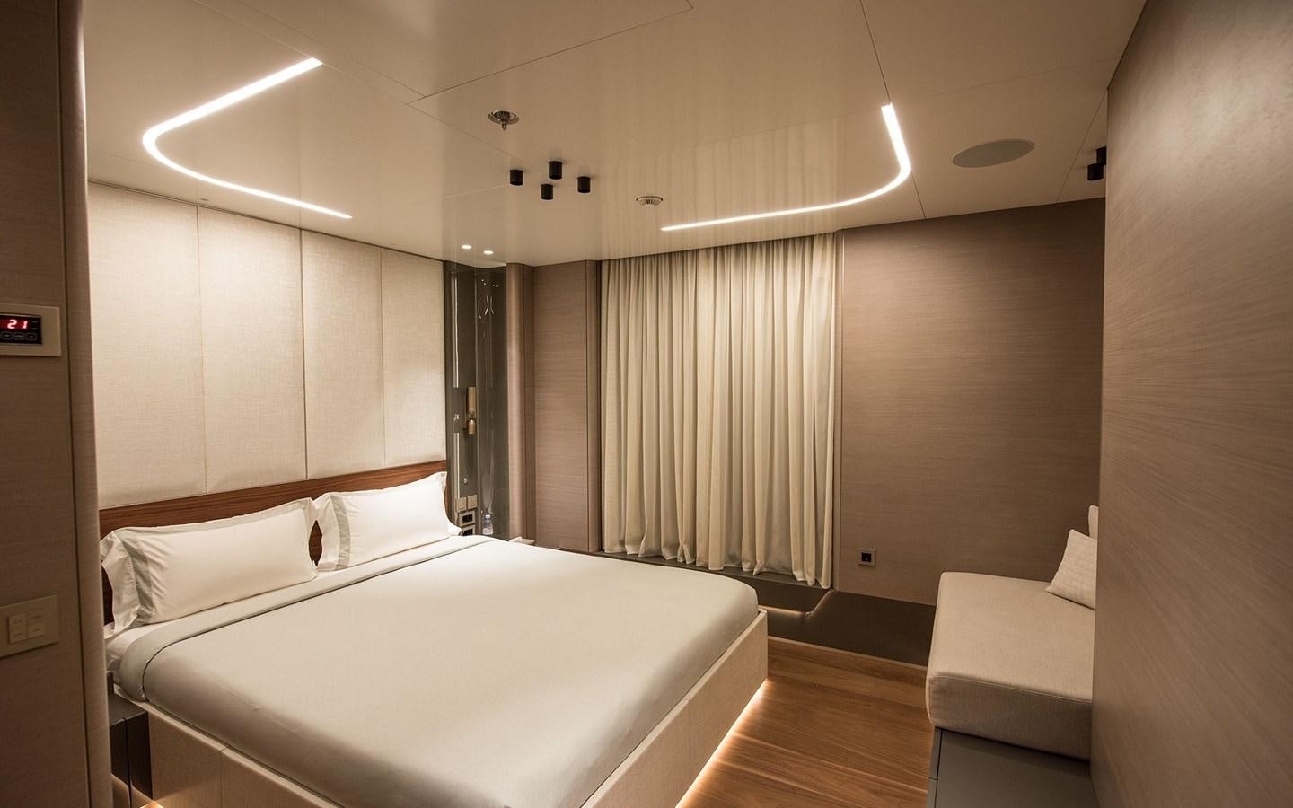 a room with a bed and a couch aboard FLORENTIA Yacht for Sale