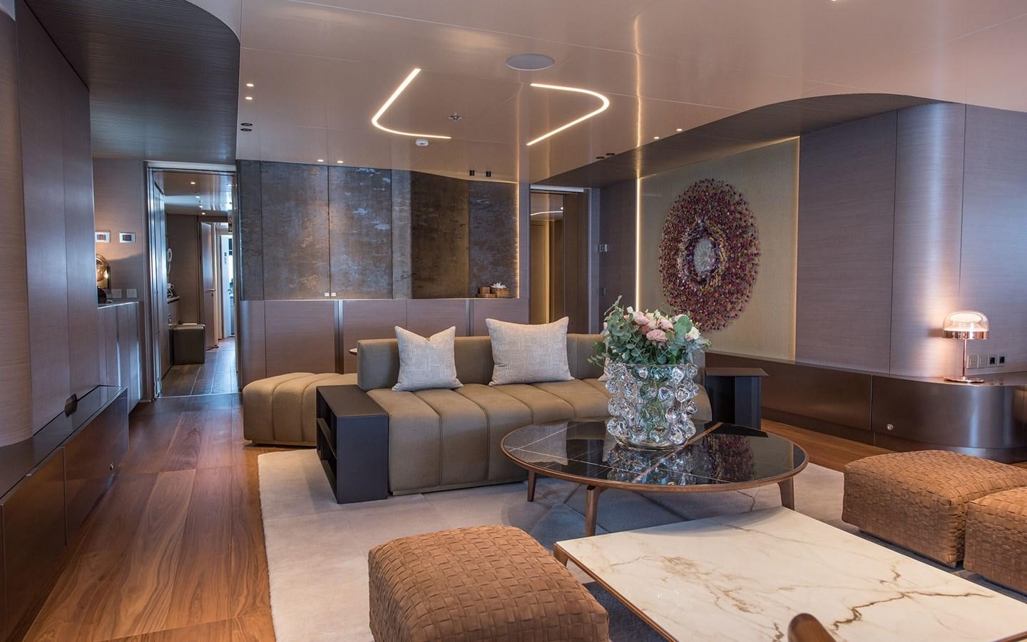 a living room with a large mirror aboard FLORENTIA Yacht for Sale