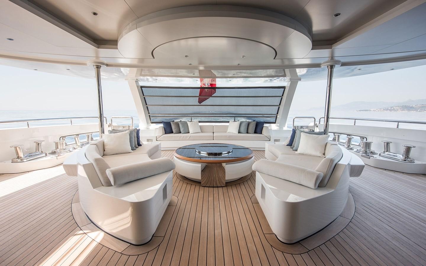 a room with a table and chairs aboard FLORENTIA Yacht for Sale