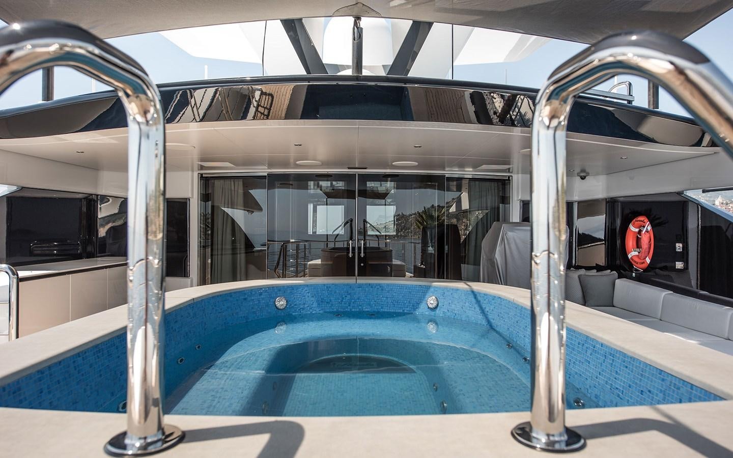 a large blue pool aboard FLORENTIA Yacht for Sale