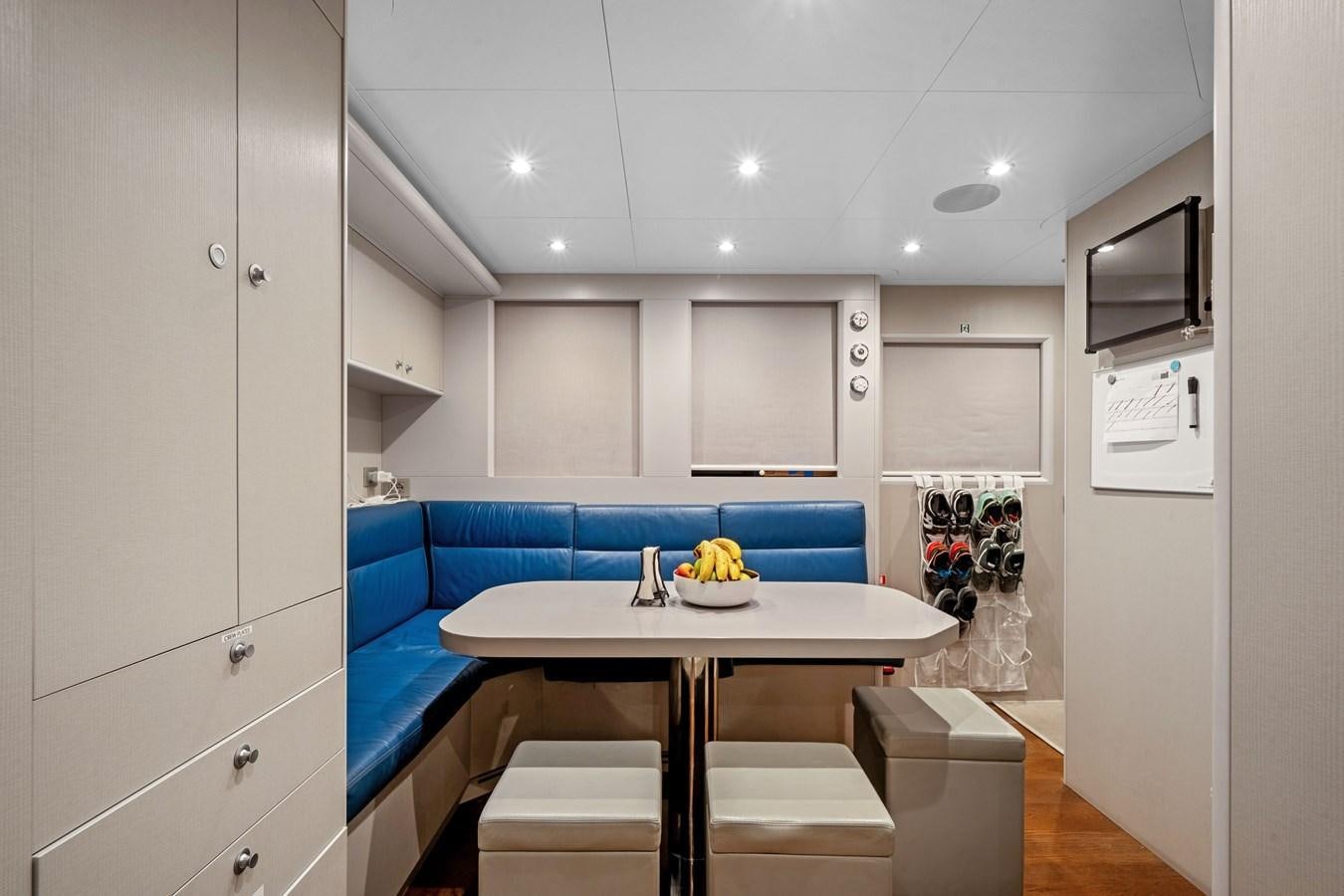 a kitchen with a table and chairs aboard 2017 CANTIERE DELLE MARCHE DARWIN/ATLAS Yacht for Sale