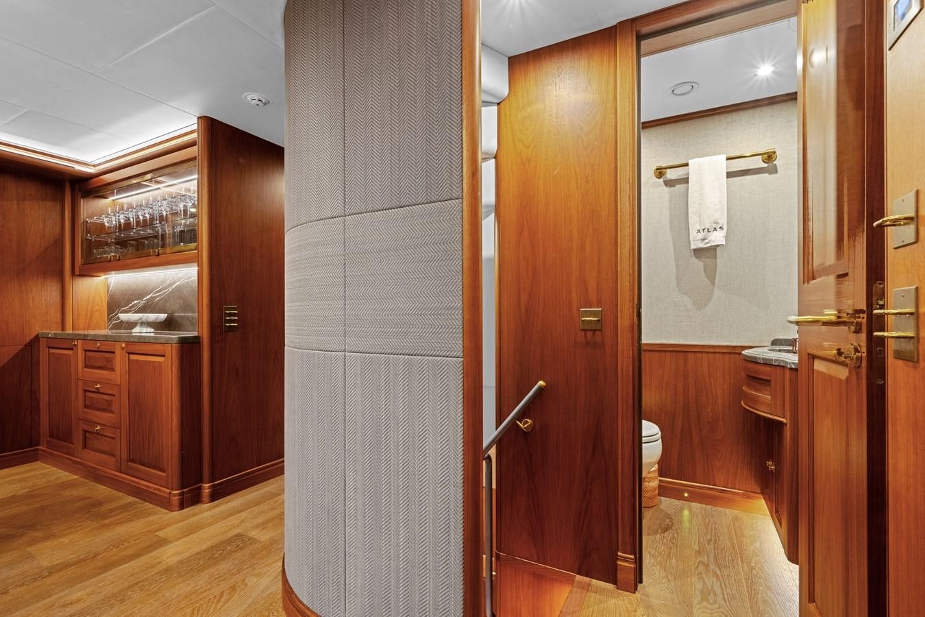 a bathroom with wooden cabinets aboard 2017 CANTIERE DELLE MARCHE DARWIN/ATLAS Yacht for Sale