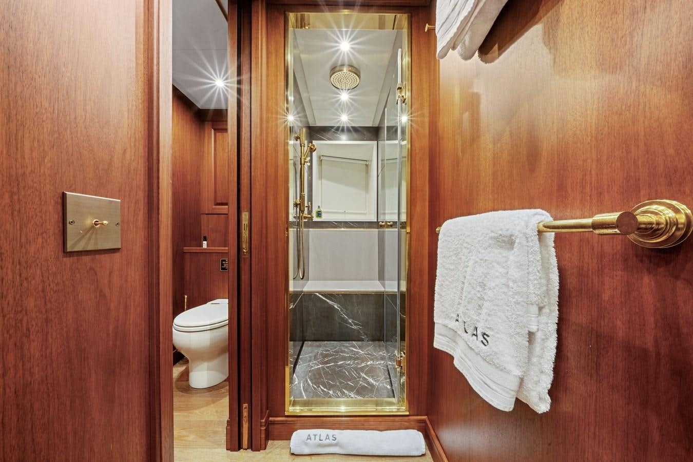 a bathroom with a glass shower aboard 2017 CANTIERE DELLE MARCHE DARWIN/ATLAS Yacht for Sale