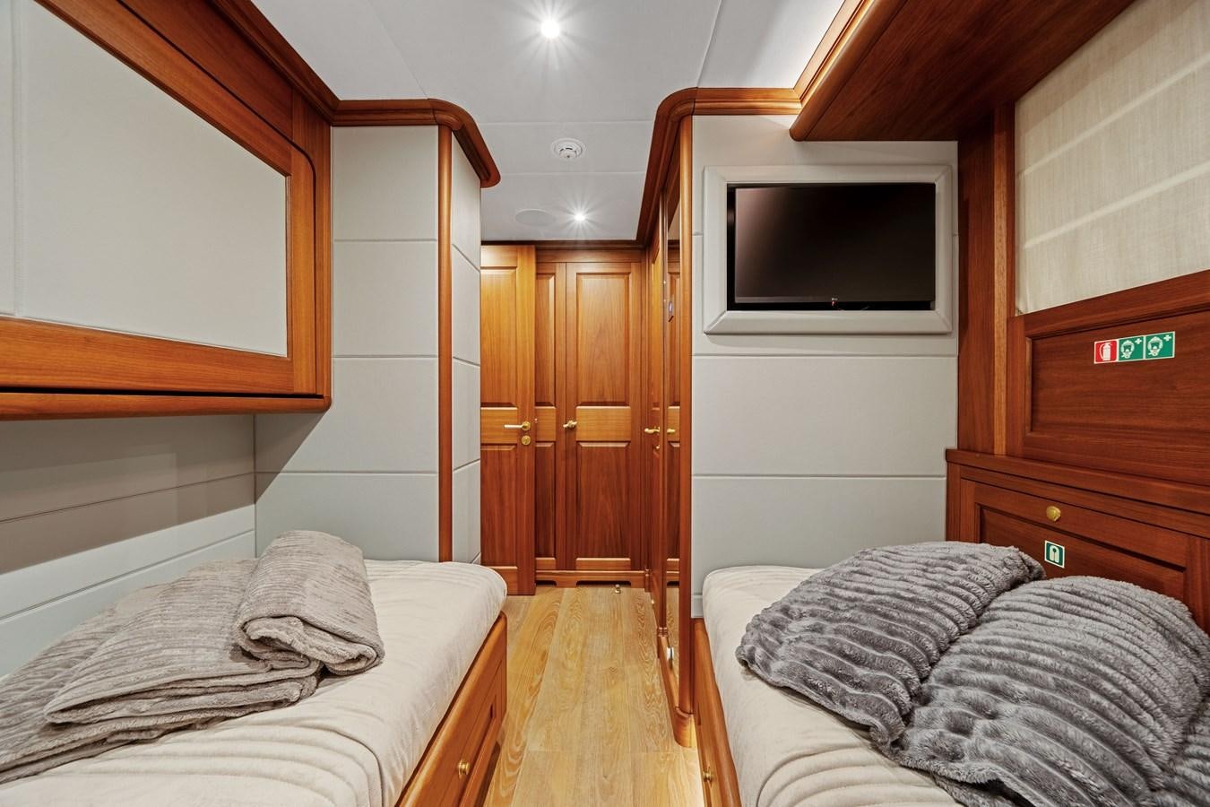 a bedroom with a bed and a television aboard 2017 CANTIERE DELLE MARCHE DARWIN/ATLAS Yacht for Sale