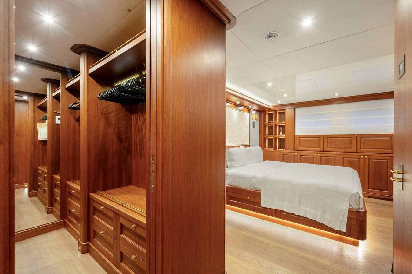 a bedroom with a bed and a closet aboard 2017 CANTIERE DELLE MARCHE DARWIN/ATLAS Yacht for Sale