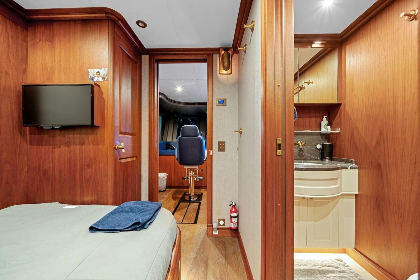 a room with a bed and a television aboard 2017 CANTIERE DELLE MARCHE DARWIN/ATLAS Yacht for Sale