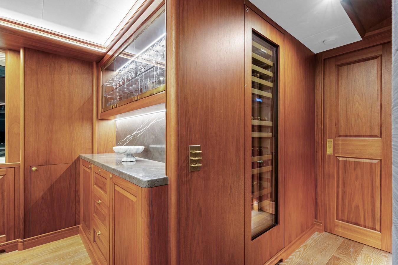 a wooden cabinet in a kitchen aboard 2017 CANTIERE DELLE MARCHE DARWIN/ATLAS Yacht for Sale