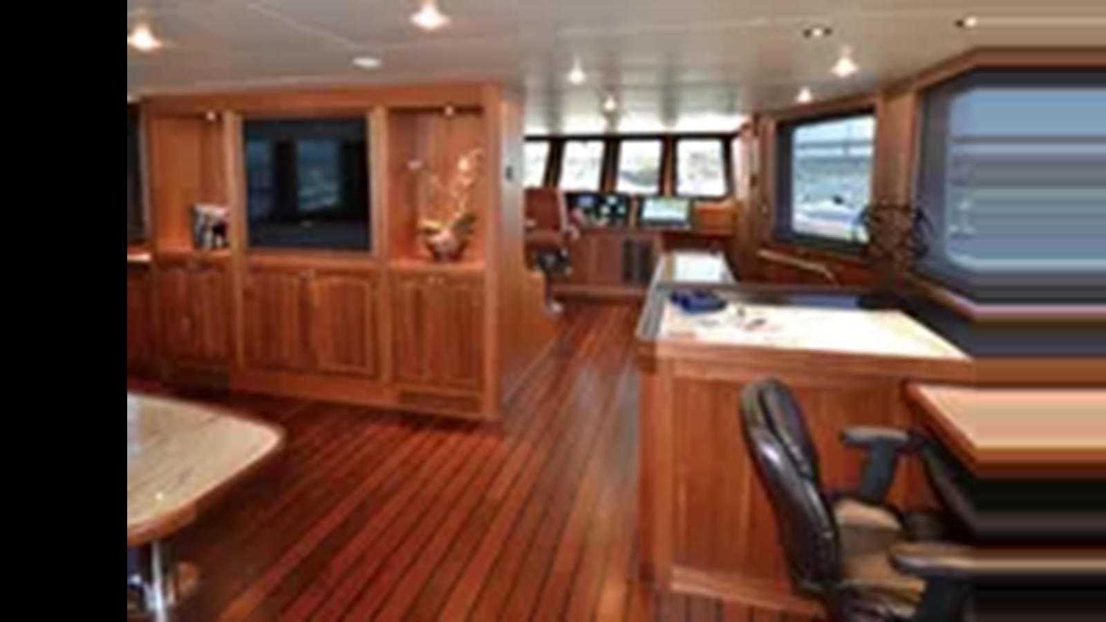 a room with a desk and chairs aboard 2018 ALLSEAS EXPEDITION Yacht for Sale