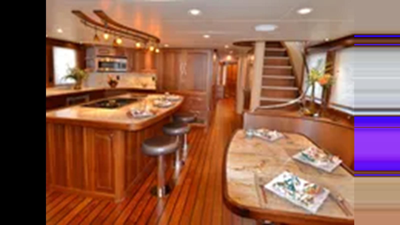 a kitchen with wooden cabinets aboard 2018 ALLSEAS EXPEDITION Yacht for Sale