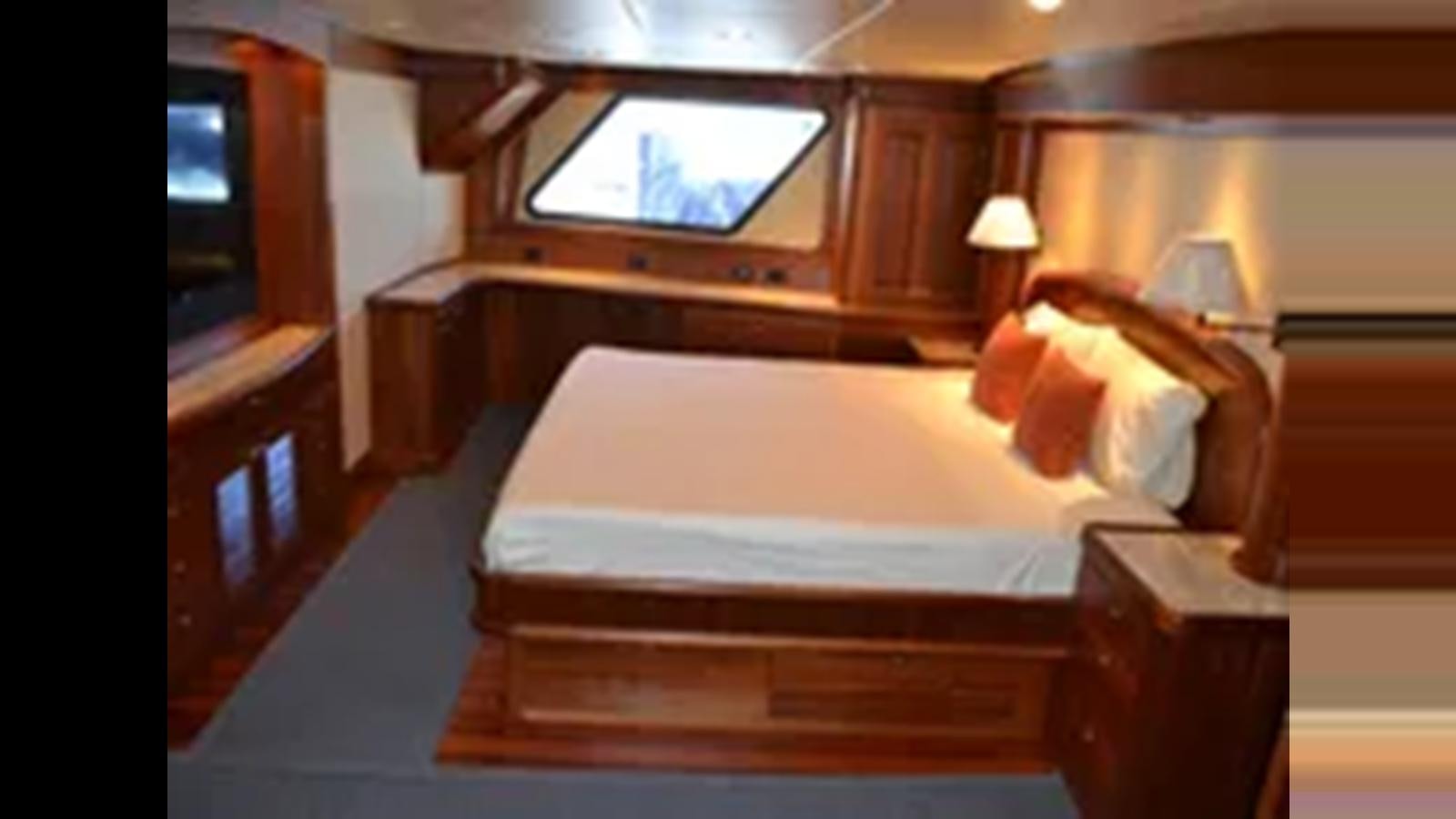 a bed in a room aboard 2018 ALLSEAS EXPEDITION Yacht for Sale