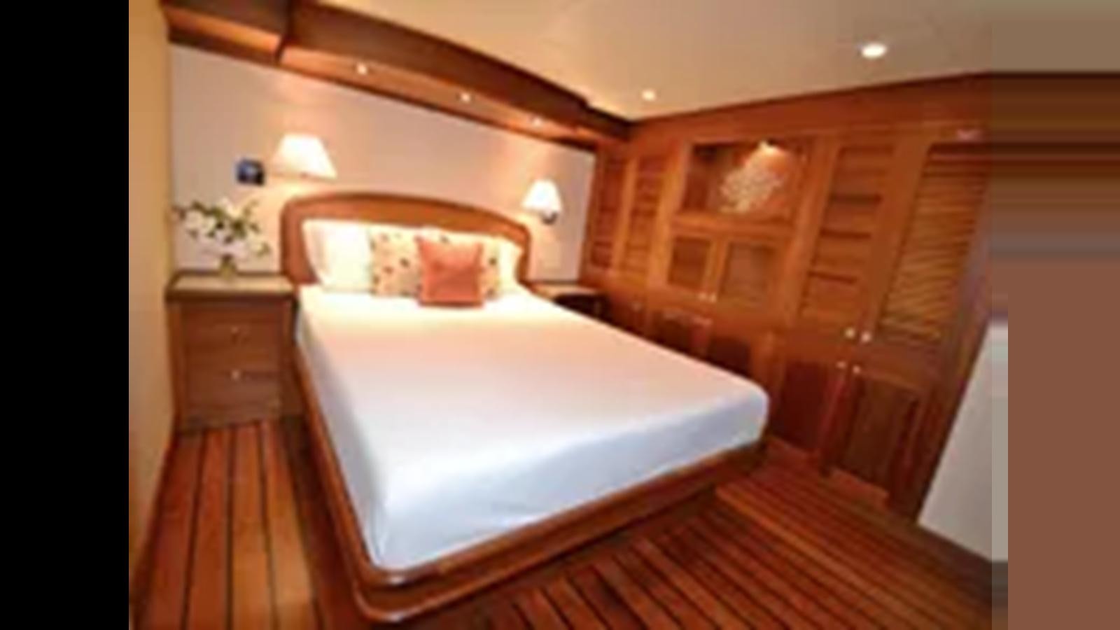 a bed in a room aboard 2018 ALLSEAS EXPEDITION Yacht for Sale