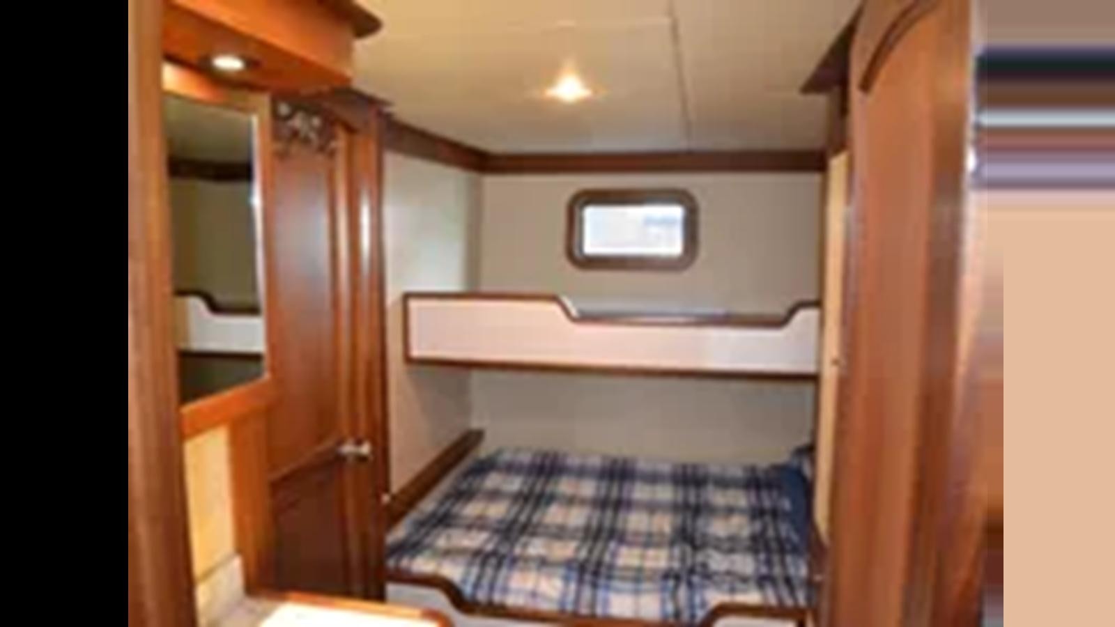 a bed in a room aboard 2018 ALLSEAS EXPEDITION Yacht for Sale