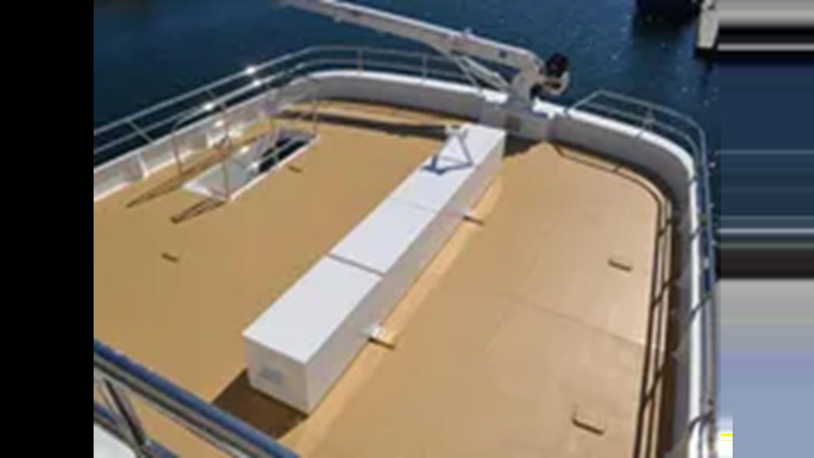 a white boat on a deck aboard 2018 ALLSEAS EXPEDITION Yacht for Sale