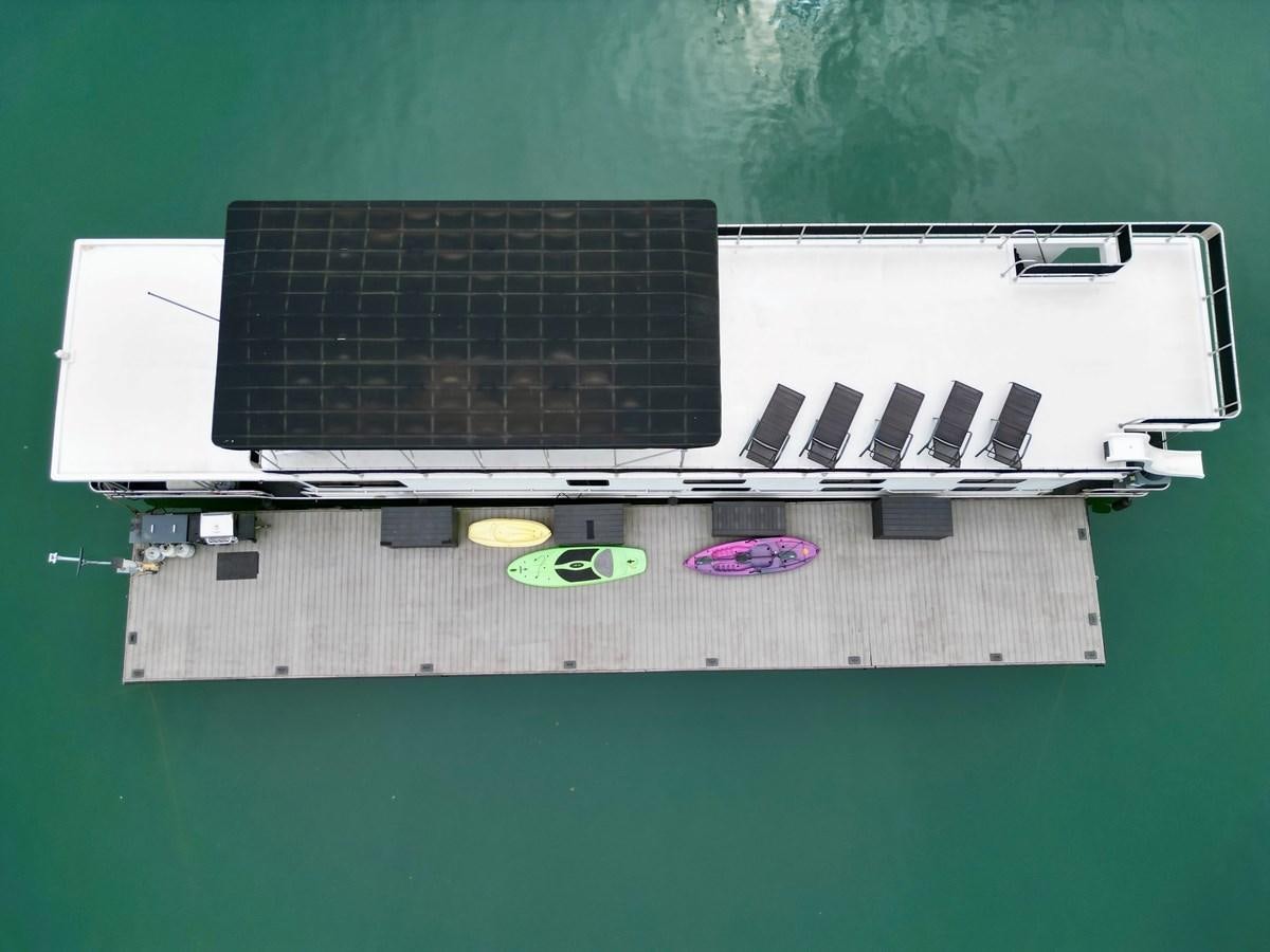 a black and silver computer aboard 2012 MAJESTIC 16 X 75WB HOUSEBOAT NLSD Yacht for Sale