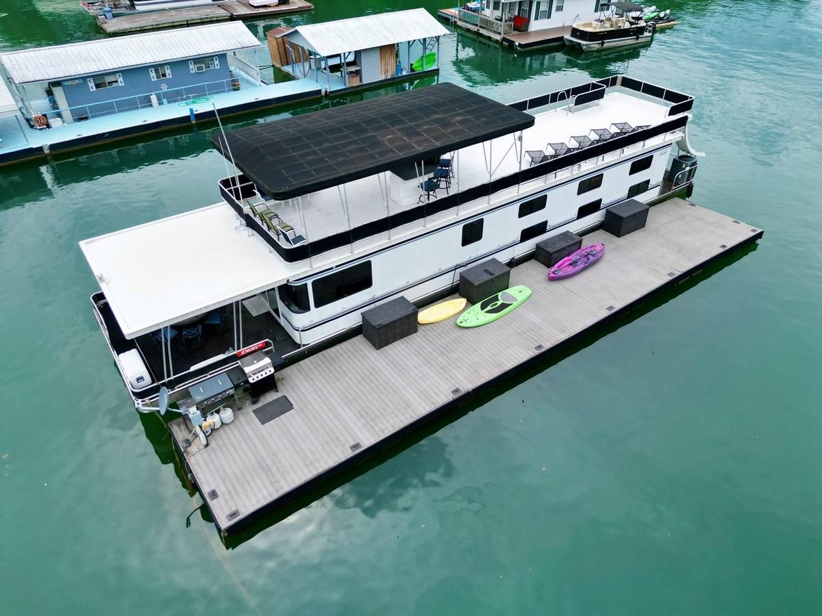 a high angle view of a boat aboard 2012 MAJESTIC 16 X 75WB HOUSEBOAT NLSD Yacht for Sale