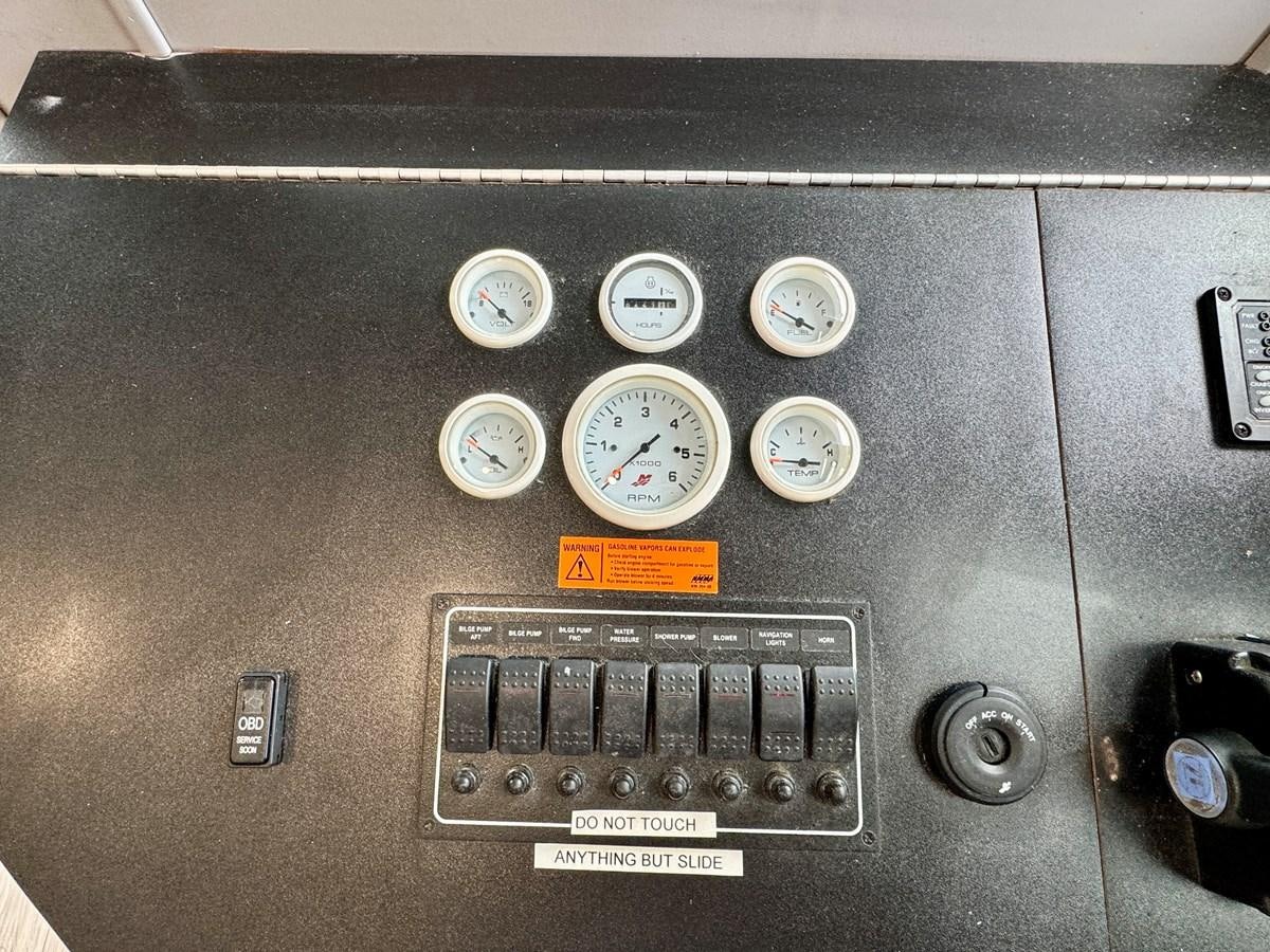 a black box with dials and buttons aboard 2012 MAJESTIC 16 X 75WB HOUSEBOAT NLSD Yacht for Sale