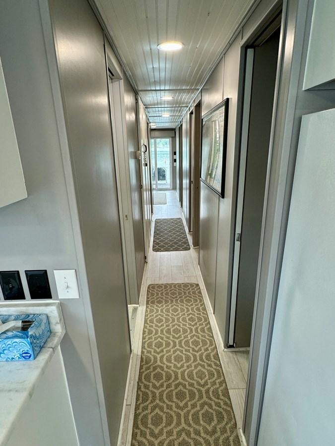 a hallway with a tile floor aboard 2012 MAJESTIC 16 X 75WB HOUSEBOAT NLSD Yacht for Sale