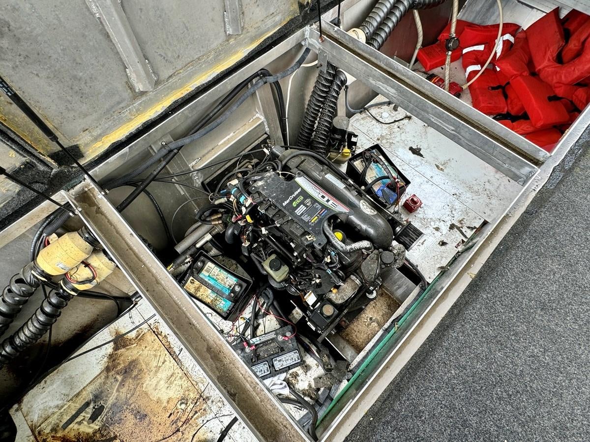 a car with its hood open aboard 2012 MAJESTIC 16 X 75WB HOUSEBOAT NLSD Yacht for Sale