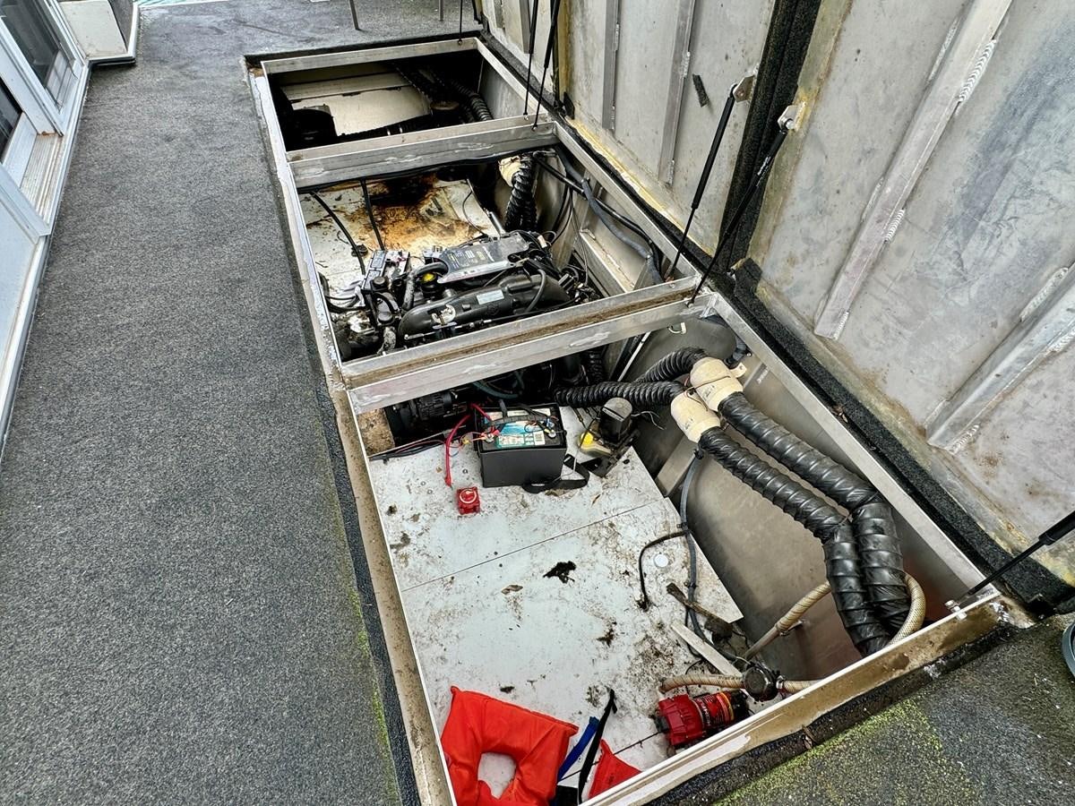 a car with a door open aboard 2012 MAJESTIC 16 X 75WB HOUSEBOAT NLSD Yacht for Sale