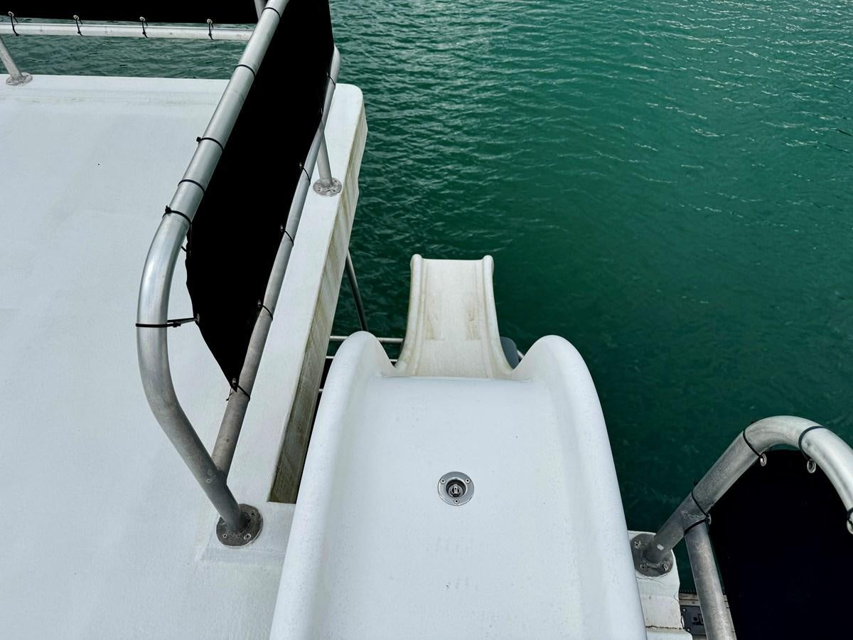 a boat on the water aboard 2012 MAJESTIC 16 X 75WB HOUSEBOAT NLSD Yacht for Sale