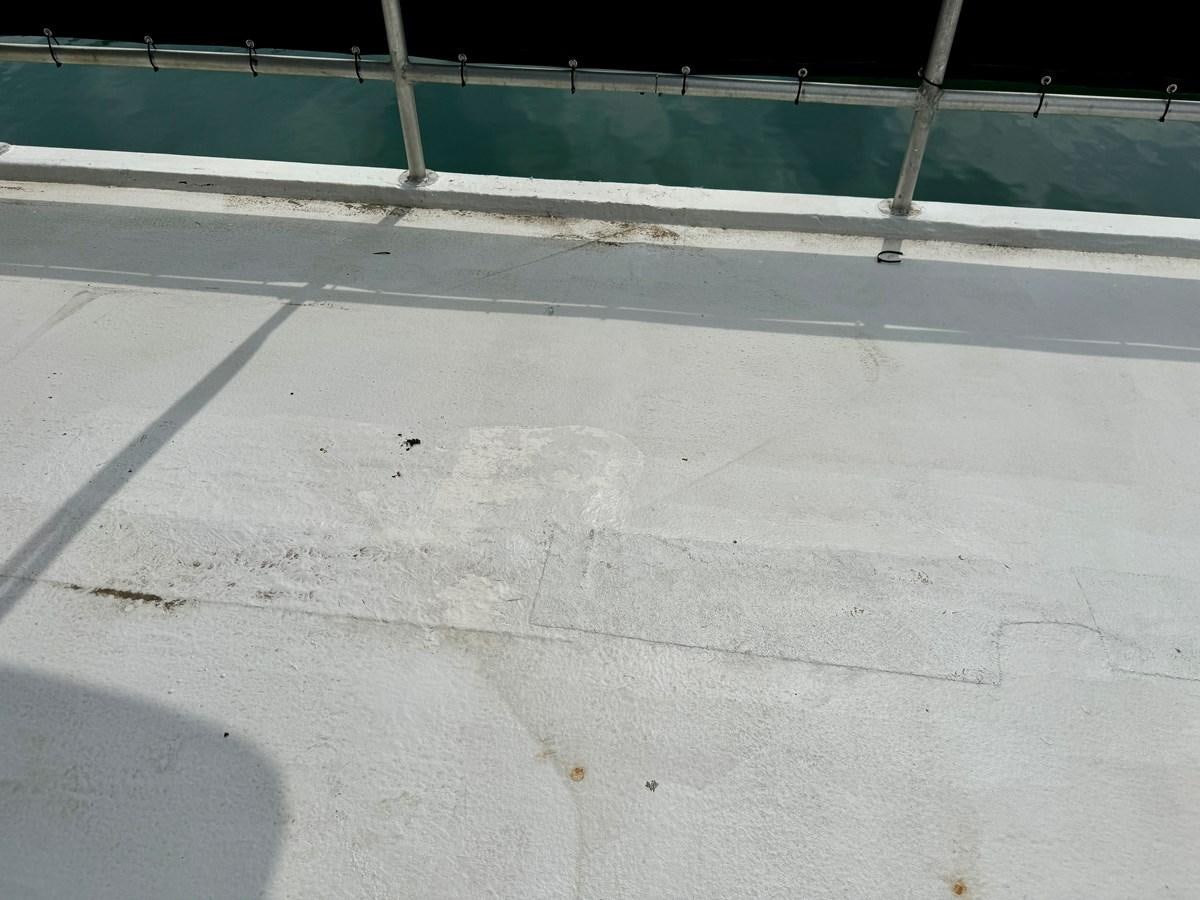 a concrete surface with a green wall aboard 2012 MAJESTIC 16 X 75WB HOUSEBOAT NLSD Yacht for Sale