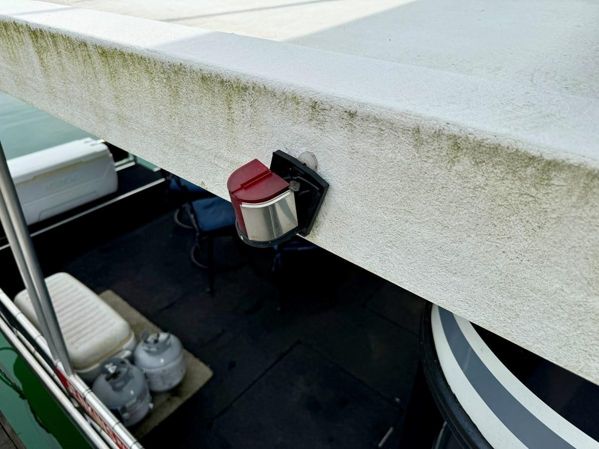 a red bucket on a table aboard 2012 MAJESTIC 16 X 75WB HOUSEBOAT NLSD Yacht for Sale